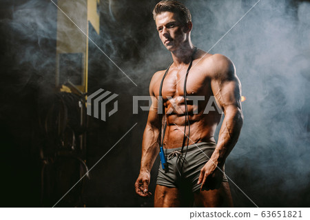 Handsome caucasian sexy fitness model in gym close 63651821
