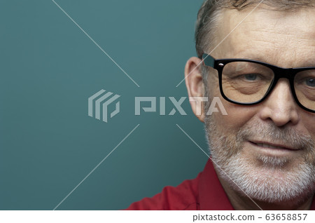 Portrait of elderly man smiling in eyeglasses Portrait of elderly man smiling in eyeglasses 63658857