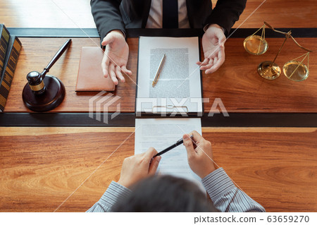 Lawyer working with client discussing contract Lawyer working with client discussing contract 63659270