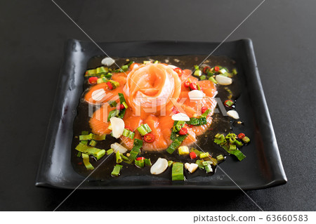 fresh salmon raw spicy salad 63660583