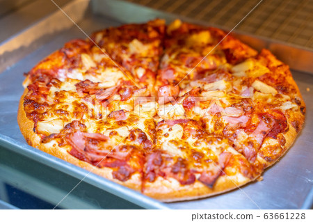 bake homemade pizza hot from oven 63661228