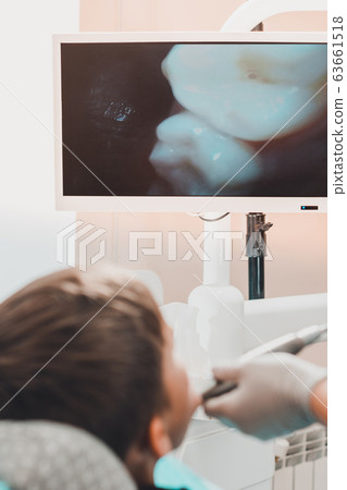 The boy visits an orthodontist to align permanent 63661518