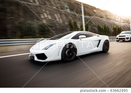 White sport model car on the highway 63662895