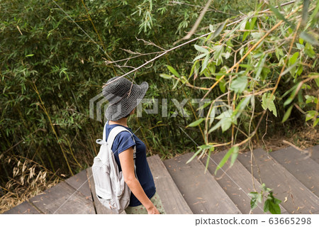 Asian woman hiking Asian woman hiking 63665298