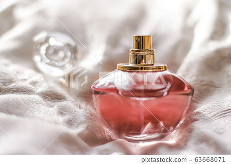 Perfume bottle with aromatic floral scent, luxury fragrance 63668071