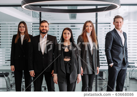Confident team. Successful colleagues posing at camera 63668086