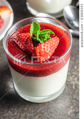 Italian dessert panna cotta with strawberries 63669343