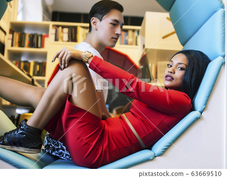 couple students in univercity library, looking book, preparing to exam, having fun, making selfie, lifestyle people concept couple students in univercity library, looking book, preparing to exam, having fun, making selfie, lifestyle people concept 63669510