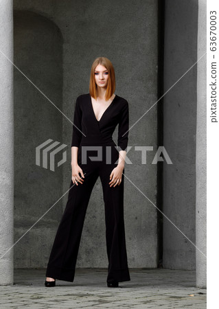 Full length portrait of red hair girl in black Full length portrait of red hair girl in black 63670003