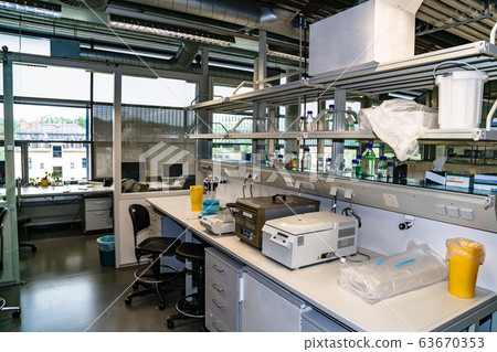 Centrifuges and other lab equipment on table Centrifuges and other lab equipment on table 63670353