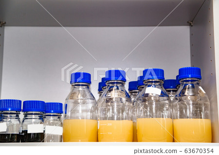 Group of laboratory flasks containing liquid color Group of laboratory flasks containing liquid color 63670354
