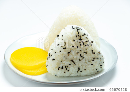 Triangle rice ball. Served with pickles. (White background) 63670528