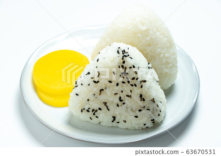 Triangle rice ball. Served with pickles. (White background) 63670531