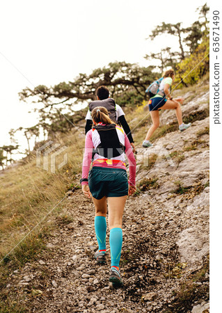 people walking mountain trail 63671490