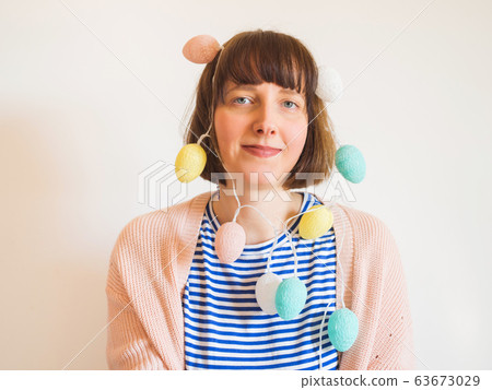 Easter concept female portrait with egg lights 63673029