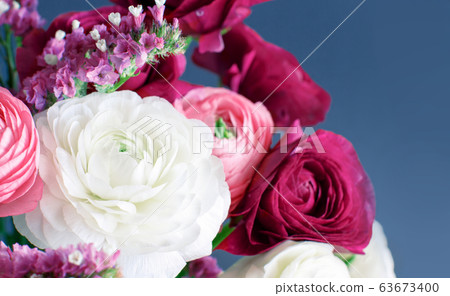 Pink, white and fuchsia flowers on a grey Pink, white and fuchsia flowers on a grey 63673400