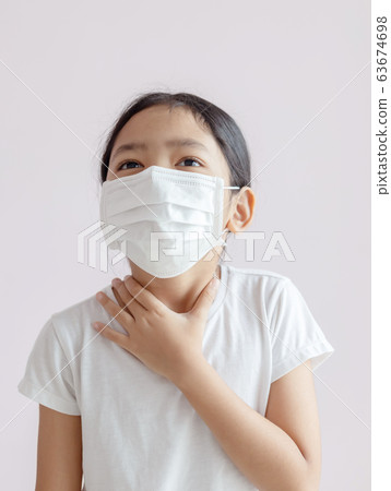 The kid wearing a protective medical mask The kid wearing a protective medical mask 63674698