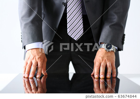 Empty arms of man in suit and tie closeup 63674844