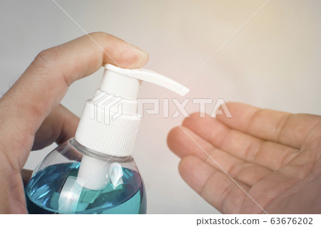 Ethyl Alcohol gel sanitizer,Men holds bottle for cleaning hand and used as disinfectant. Ethyl Alcohol gel sanitizer,Men holds bottle for cleaning hand and used as disinfectant. 63676202