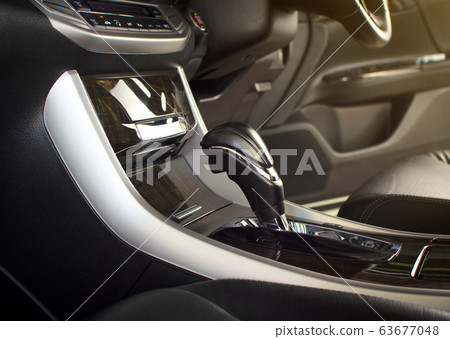 Put a gear stick into P position (Parking) on automatic transmission in a luxury car. Put a gear stick into P position (Parking) on automatic transmission in a luxury car. 63677048