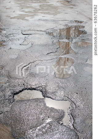 Dangerous destroyed roadbed. Bad asphalted road. 63678262