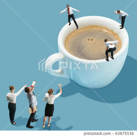 High angle view of creative office on blue background - big things and little workers High angle view of creative office on blue background - big things and little workers 63678536