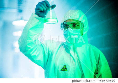 corona virus concept. male doctor reviewing glass flask corona virus concept. male doctor reviewing glass flask 63678659