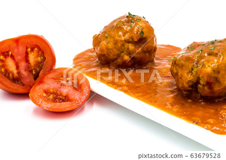 Meatballs cooked in tomato sauce 63679528