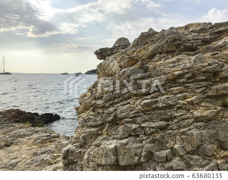 Geological rocks, sea stones on seashore. Photo Geological rocks, sea stones on seashore. Photo 63680135
