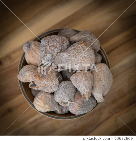 Dried fruit composition on wood background Dried fruit composition on wood background 63682609