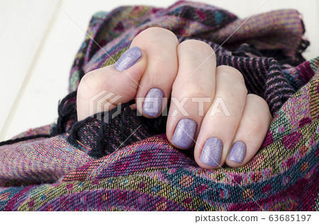 Hand of an adult woman with painted nails, Hand of an adult woman with painted nails, 63685197