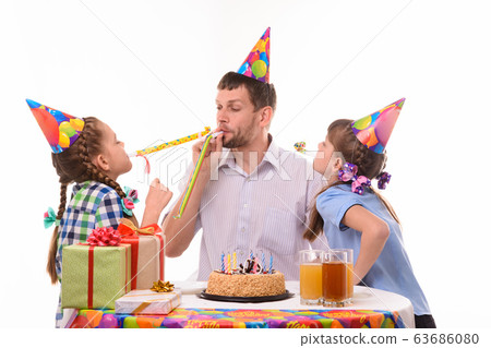 Children and dad joyfully blow whistles to the Children and dad joyfully blow whistles to the 63686080