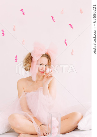 woman holiday marshmallows curly hair bow joy woman holiday marshmallows curly hair bow joy 63686221