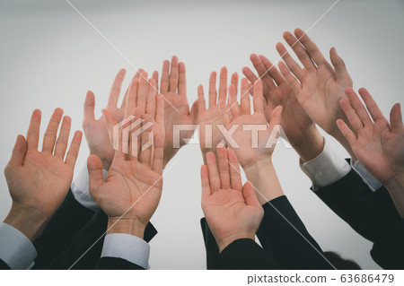 Business person raising hand Business person raising hand 63686479