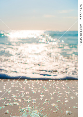 Idyllic tropical beach with white sand, turquoise ocean water and blue sky on Caribbean island Idyllic tropical beach with white sand, turquoise ocean water and blue sky on Caribbean island 63687320