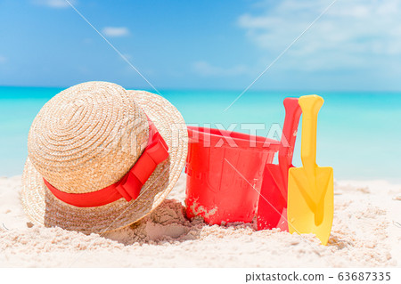 Beach kid's toys on white sand beach 63687335