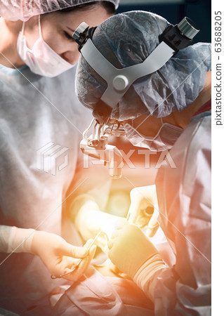 A shot of an emergency and a serious accident in the operating room, a team of surgeons makes an emergency operation to people in an accident. Saving lives, modern medetsina. 63688205