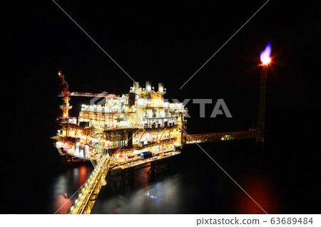 Offshore construction platform for production oil and gas. Oil and gas industry and hard work. Production platform and operation process by manual and auto function from control room. Offshore construction platform for production oil and gas. Oil and gas industry and hard work. Production platform and operation process by manual and auto function from control room. 63689484