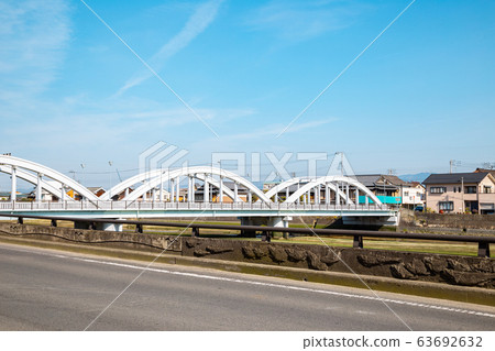 Kanonji village Sanka bridge with Saita river in Kagawa, Japan Kanonji village Sanka bridge with Saita river in Kagawa, Japan 63692632