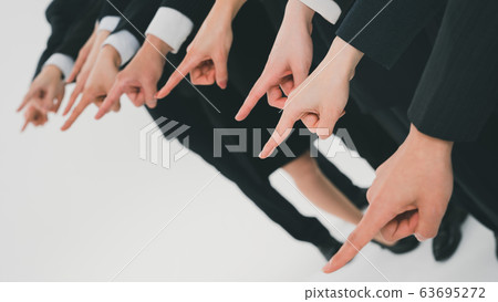 Business person pointing 63695272