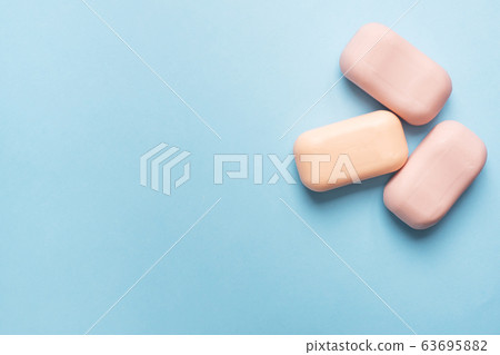 Natural soap on a blue pink background. Flat lay the concept of Spa cleanliness of hands. copy space Natural soap on a blue pink background. Flat lay the concept of Spa cleanliness of hands. copy space 63695882