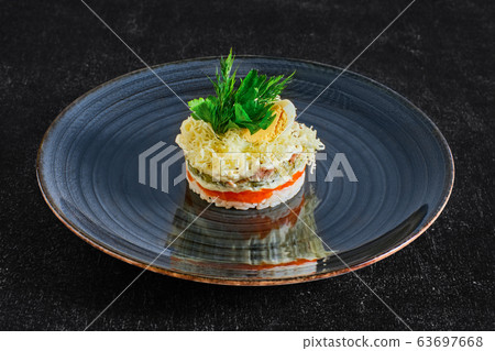Layered salad with rice, carrot, pickled cucumber 63697668