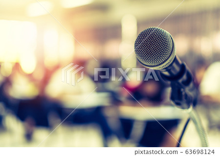 Microphone voice speaker in business seminar, speech presentation, town hall meeting, lecture hall or conference room in corporate or community event for host or townhall public hearing 63698124