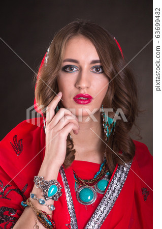 Woman in red sari 63699482