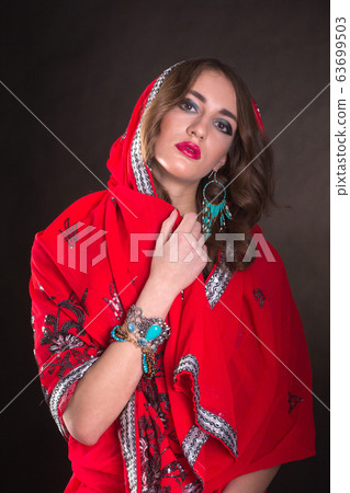 Woman in red sari 63699503