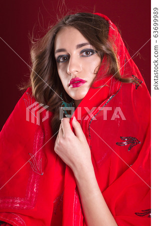 Woman in red sari 63699989