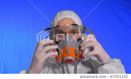 Scientist virologist in respirator. Man close up look, wearing protective medical mask. Concept health safety N1H1 coronavirus epidemic 2019 nCoV. 63701202
