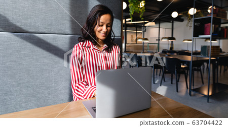African American woman using her laptop 63704422