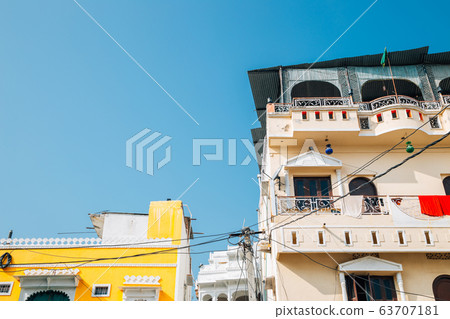 Colorful buildings under blue sky in Udaipur, India Colorful buildings under blue sky in Udaipur, India 63707181