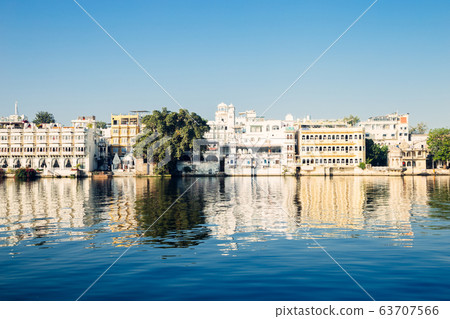 Pichola lake and old buildings in Udaipur, India Pichola lake and old buildings in Udaipur, India 63707566
